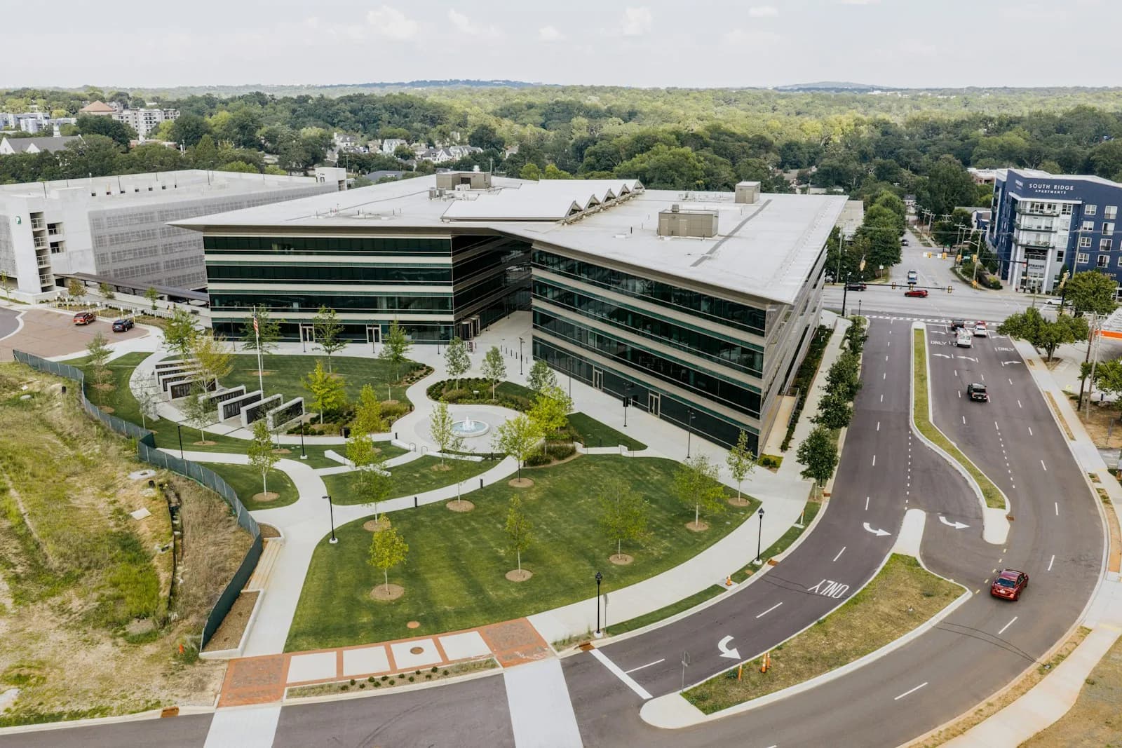 Aerial view of an office campus with landscaped lawns and walkways